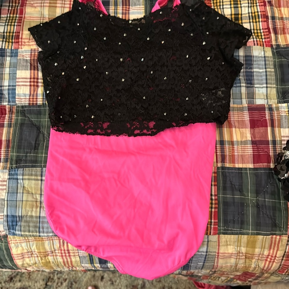 hot pink leotard and black mesh sequin top that goes on top
